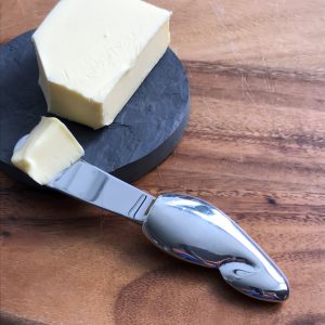 butterknife on plate with butter