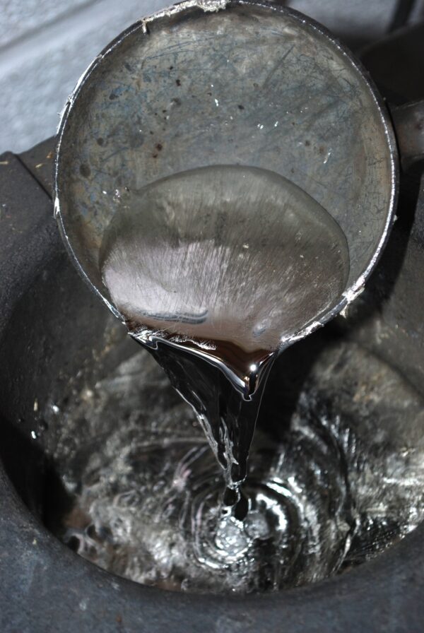 molten pewter in a ladle