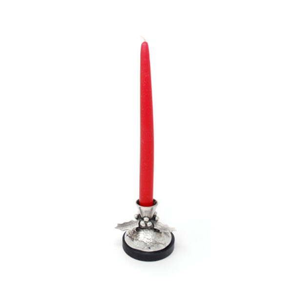 pewter holly candlestick with red candle in it and a round welsh slate base on a white background