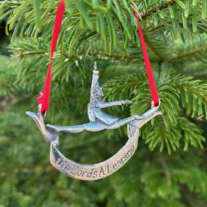 pewter decoration a banner saying 10 lords a leaping and a lord legs spread leaping over the banner