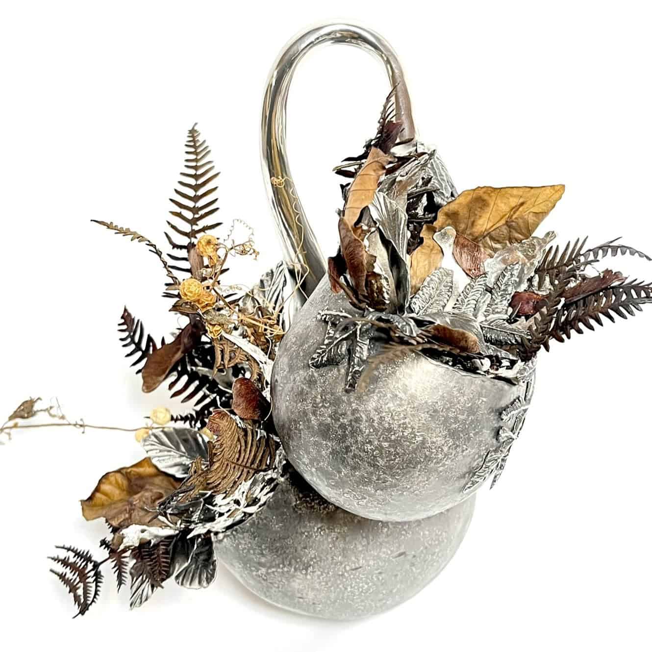 Hand raised pewter sculpture with preserved botanicals