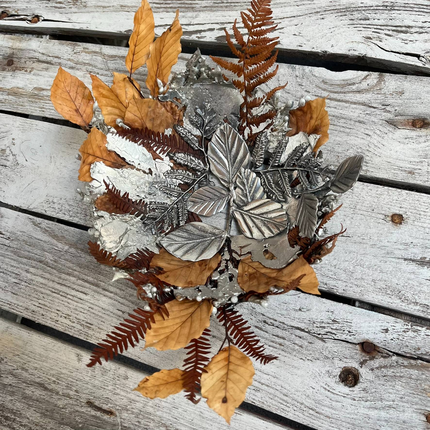 didden leaves and ferns pewter sculture on a wooden boardp