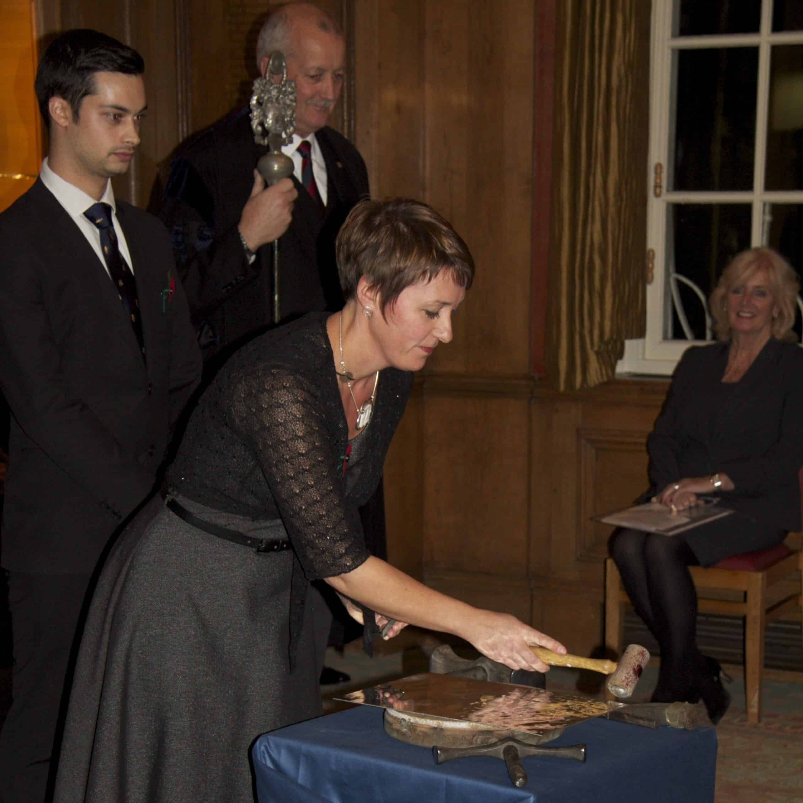 fleur striking her mark on pewter and the hammer and stamp